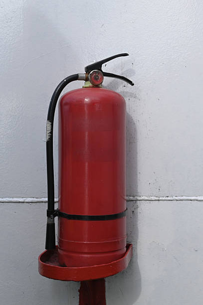 Red Fire Extinguisher on the Wall of a Passenger Ship