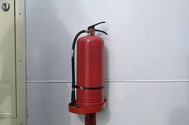 Red Fire Extinguisher on the Wall of a Passenger Ship