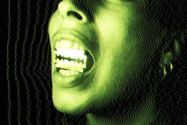 Aggressive close-up portrait styled with green CRT distortion and analog screen noise, featuring a bold punk aesthetic and razor blade symbolism. The visual language merges retro futurism, underground rebellion, and cyberpunk culture, evoking themes of anti-establishment attitude, digital decay, media distortion, and dystopian identity. The raw texture and monochromatic green palette reference vintage monitor screens and analog interference. Ideal for music visuals, underground branding, alternative fashion editorials, glitch art projects, and cyberpunk-inspired creative campaigns.