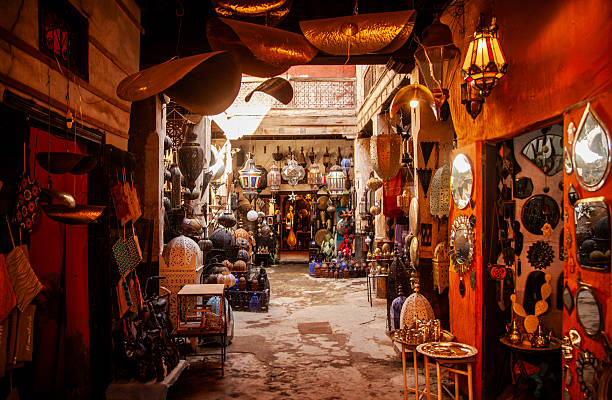 Morocco, Marrakech, market called a medina,  food and cookware shops.  colourful display dishes for sell to tourists.