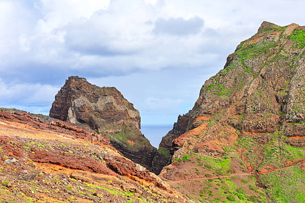 Magnificent vista with very high cliff and coastal city in background, Madeira, Portugal.