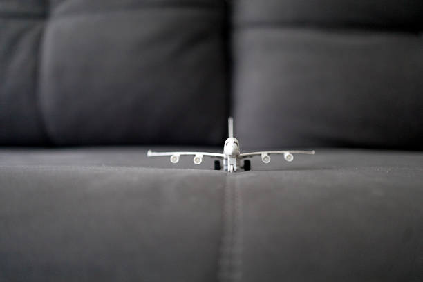 a toy airplane on the sofa