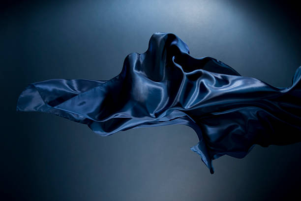 istock Dark blue silk fabric floats and levitates against a dark background in this artistic scene 2262309984