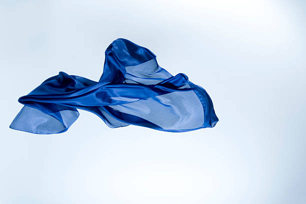 istock Blue silk fabric floating against a light background in a clear display 2262310020