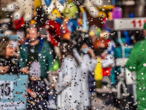 Augustinergasse, Basel, Switzerland - March 12th, 2019. Carnival masks and snare drums piled up in a street corner