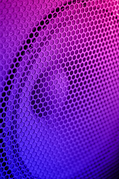 Sound Speaker grill texture. Macro shot. Neon color tone
