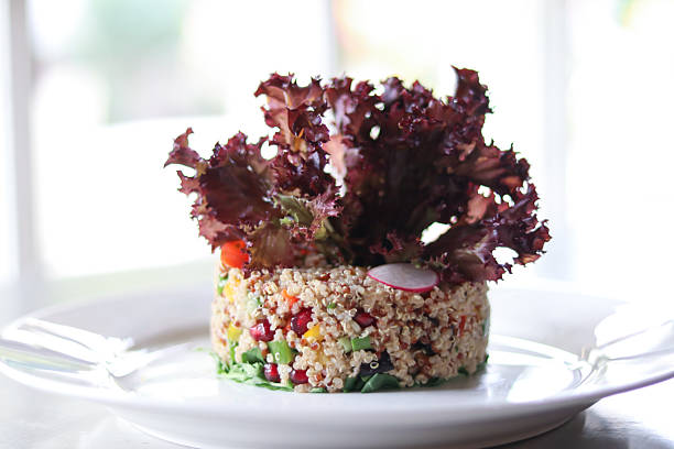 Fresh quinoa salad with vibrant vegetables and crisp lettuce, perfect for a healthy meal