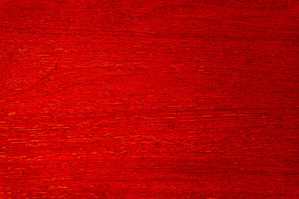Bright red wood texture paneling abstract background with visible wood grain details