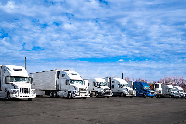 istock Logistics fleet. Trucks parked under blue sky 2262402198