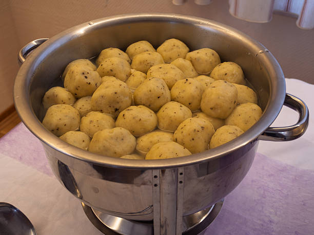 Fluffy German-style Dumplings Cooking in a Pot