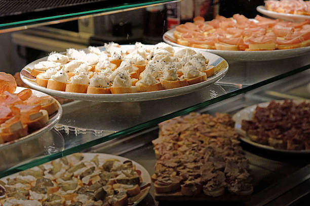 Appetizers, snacks, sandwiches, crostini with salmon, cod, cheese, fruit sauces, fish salad, farro salad