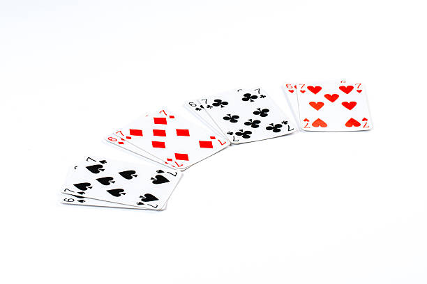 A collection of playing cards displayed in a fan shape against a clean white background, highlighting suits and numbers, perfect for gaming and leisure themes