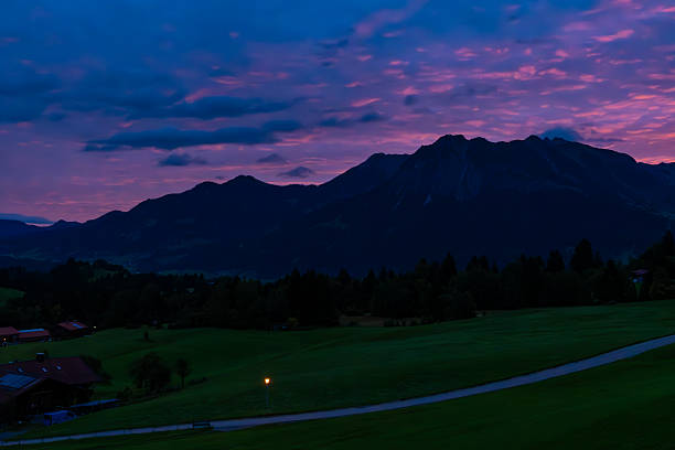 Tourism and travel concept image. Amazing silhouettes of mountains at a colorful sunset. View from Kulm Mountain, East Styria