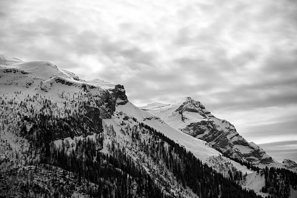 Snow covered Cathedral Range (behind Half Dome ) with prominent peaks like Cloud's Rest and Vogelsang Peak.\n\nTaken in Yosemite National Park, California, USA