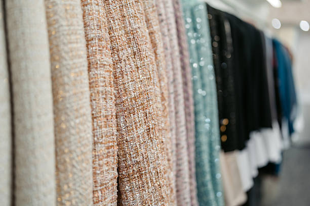 Interior of an industrial warehouse with fabric rolls samples. Small business textile colorful warehouse. High quality photo