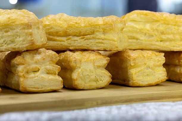 Delicious pastries on a plate at the counter at the bakery. Diet breakfast.