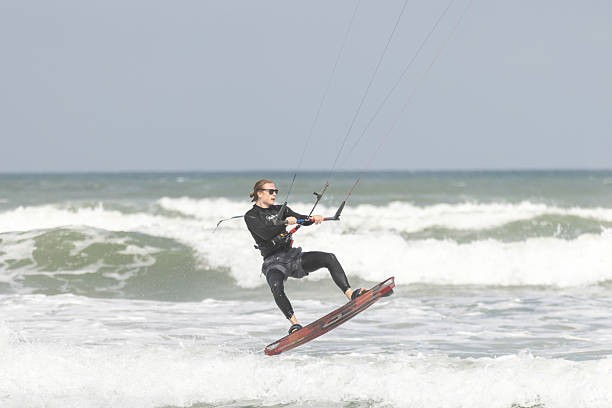 19 February 2026, Danang - Vietnam.Young man is kitesurfing on South China Sea.The best time for kitesurfing in Vietnam is the Northeast monsoon season from November to April, with peak conditions from December to February.