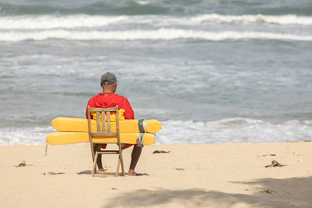 A vacationer enjoys the sun and the sand on the beach at the Sunny Beach summer resort, Black Sea, Bulgaria.