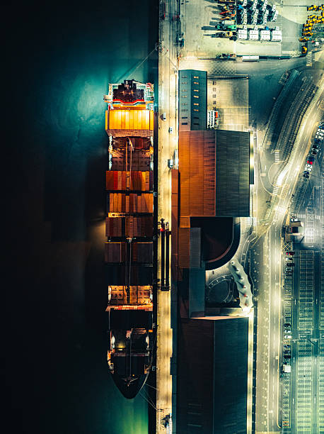 Cargo ship docked at southampton port during night