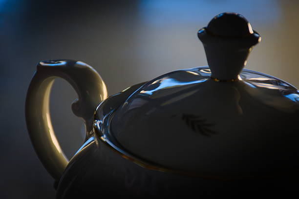 a teapot seen up close, blurred background