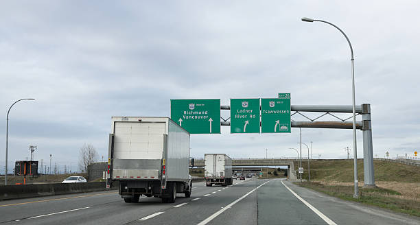 Delta, Canada - February 16, 2026: Looking west along Highway 99 in the Exit 26 lane leading to High 17 to Tsawwassen and the BC Ferry Terminal. Main traffic continues on Highway 99 north to Richmond and Vancouver. Overcast winter morning in Metro Vancouver.