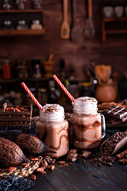 Sweet food themes: Low key chocolate smoothies on a table in a rustic kitchen