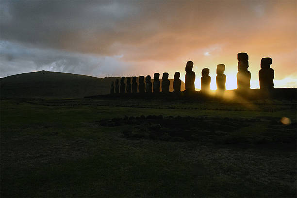Sunrise behind the Moai at Ahu Tongariki. Location is Rapa Nui/Easter Island, Chile.