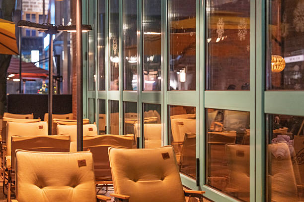 Cozy outdoor cafe seating with warm lights at night