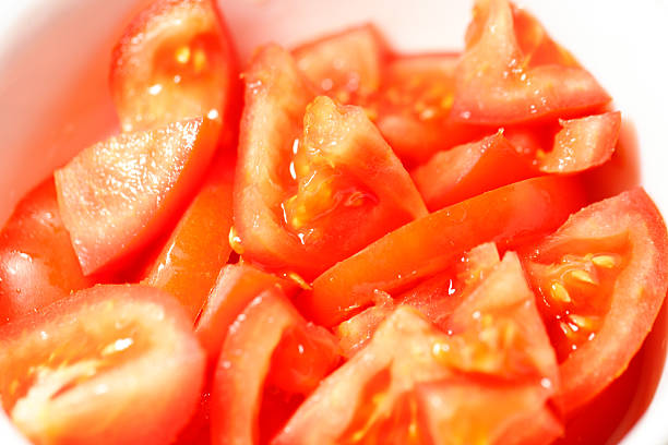 Plate with tomato sliced with oil