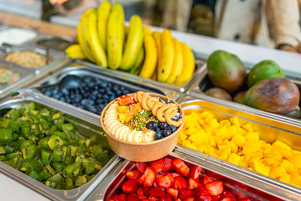 Acai bowl with fresh fruit toppings at breakfast bar