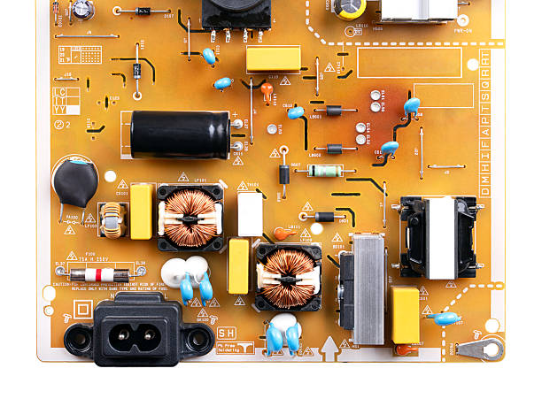 Low grade board from an television. Lower part of a brown circuit board, with fewer precious metal traces, that rely on base metals like copper and aluminum for scrap value. Isolated from above. Photo