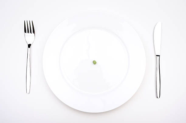 Falling green peas isolated on white background with clipping path. High quality photo