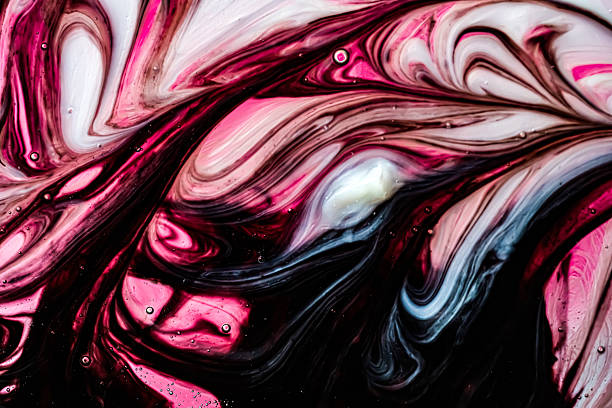 Expressive abstract fluid art macro texture with flowing pink and black liquid forms. Dynamic artistic background suitable for modern design, posters, creative visuals.