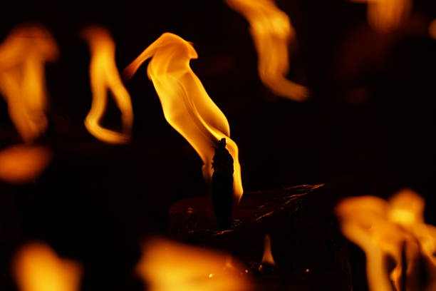 burning paper, glowing edge of paper on a black background