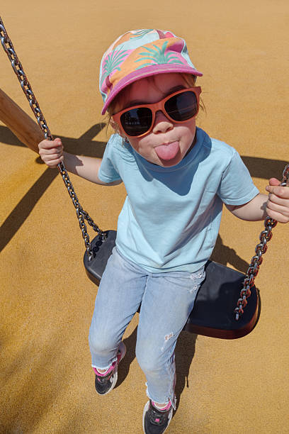 5 year old Caucasian girl playing on a playground
