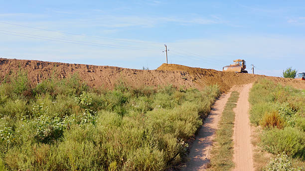 Italian countryside landscape during a summer sunset: an irrigation canal in Tuscany