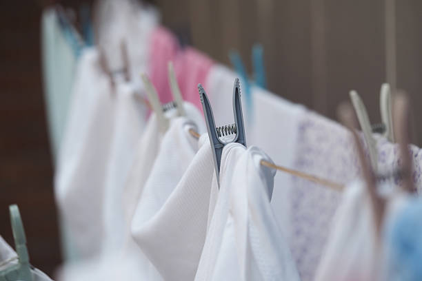 Fresh laundry hangs on a clothesline, gently swaying in the breeze.