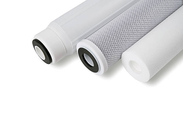 New water filter cartridges isolated on white background. Water purification technology in areas with unfavorable ecology.