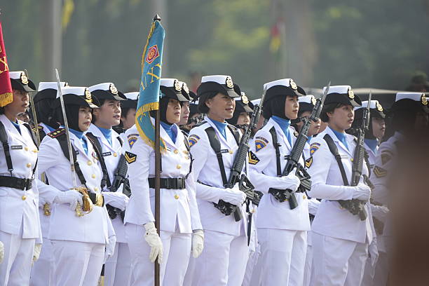 Beijing, China - October 1, 2009: Chinese women militia soldiers marching of the military parade in the celebrations for the 60th anniversary of the founding of the People\\'s Republic of China, in central Beijing.