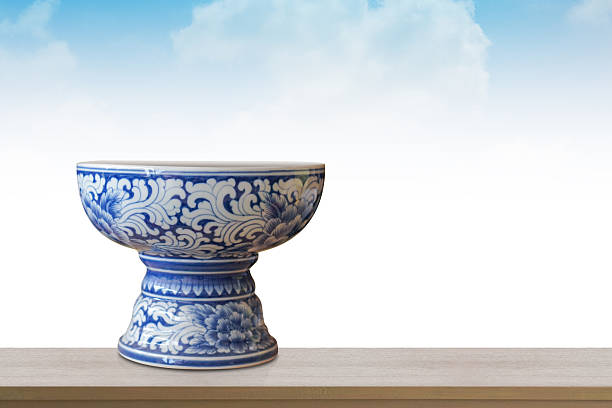 front view beautiful white and blue ceramic phan on brown wooden floor, blue sky and white cloud background, object, decor, fashion, antique, nature, copy space