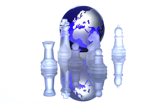 Chess pieces arranged in front of a globe show the connection between the game of chess and global strategy.