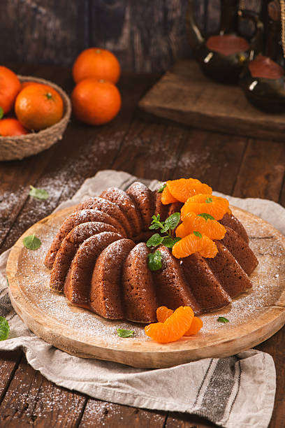 Glazed Orange Bundt Cake with Fresh Tangerine Slices and Powdere