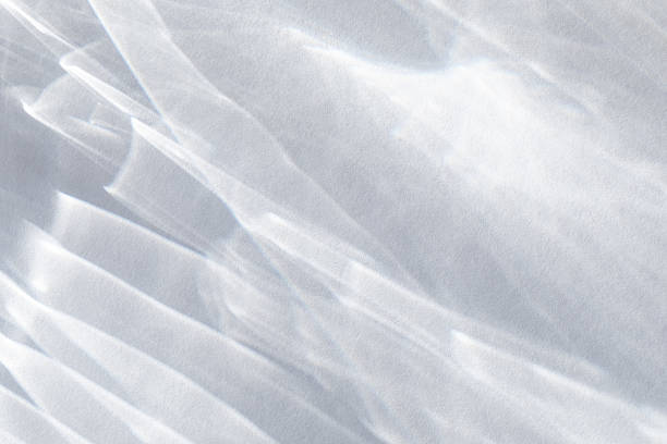 Abstract white background with glare and flare caustic effects and sun rays for design and presentation card.