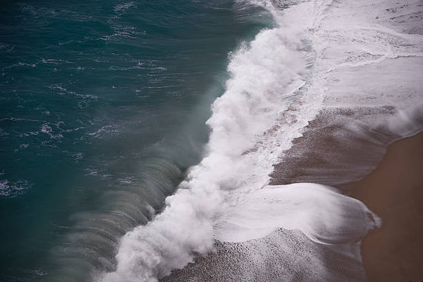 High-Resolution Ocean Wave Crashing onto Sandy Beach from Above