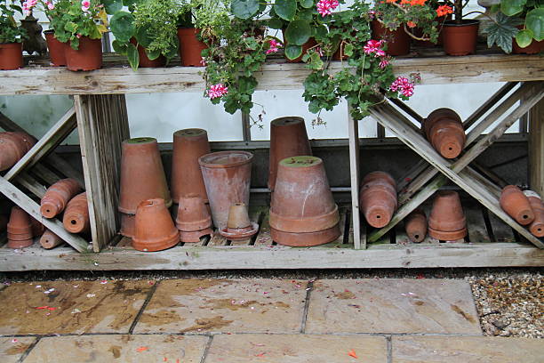 A Collection of Flower Pots at a Garden Potting Bench.