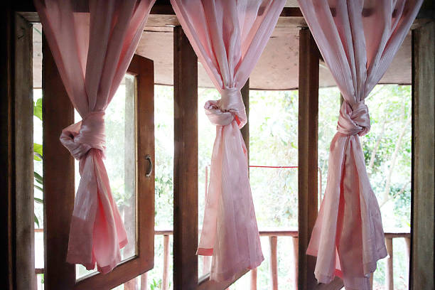 Vintage pink curtains with wooden window