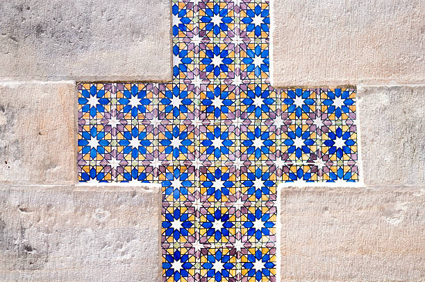Sicily style: Colorful vintage tiles from the Sicilian ceramic town of Caltagirone in a whitewashed wall (close-up shot).