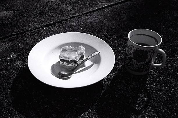 BW Analog Still Life: Coffee Mug and Cake on a Plate with Dramatic Shadows
