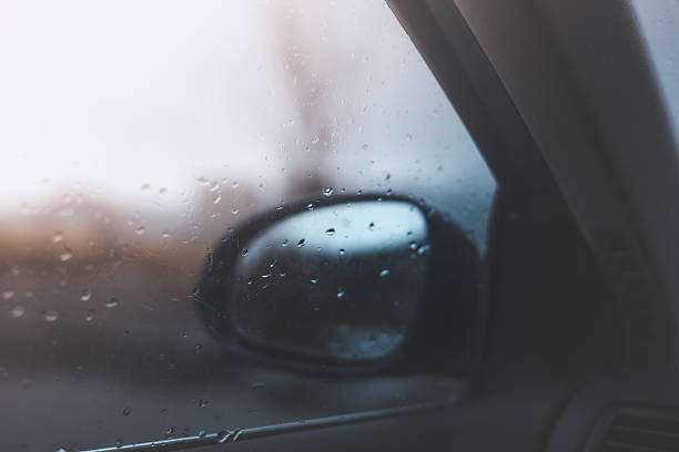 istock Raindrops slide across a car window in soft Arctic light in Vesteralen, creating a moody winter atmosphere with blurred shapes, calm colors, and quiet northern weather 2262960671