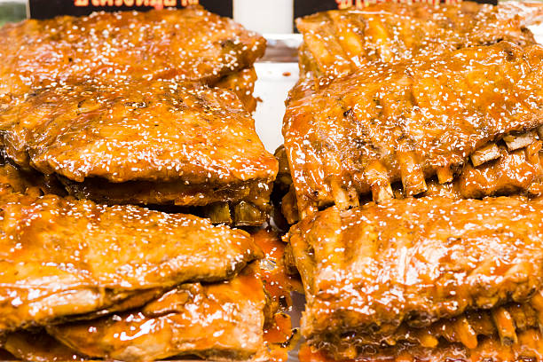 Fried pork ribs with sauce on night market in Bangkok at Phahonyothin Road